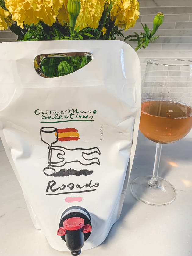 glass and bag of Rosado