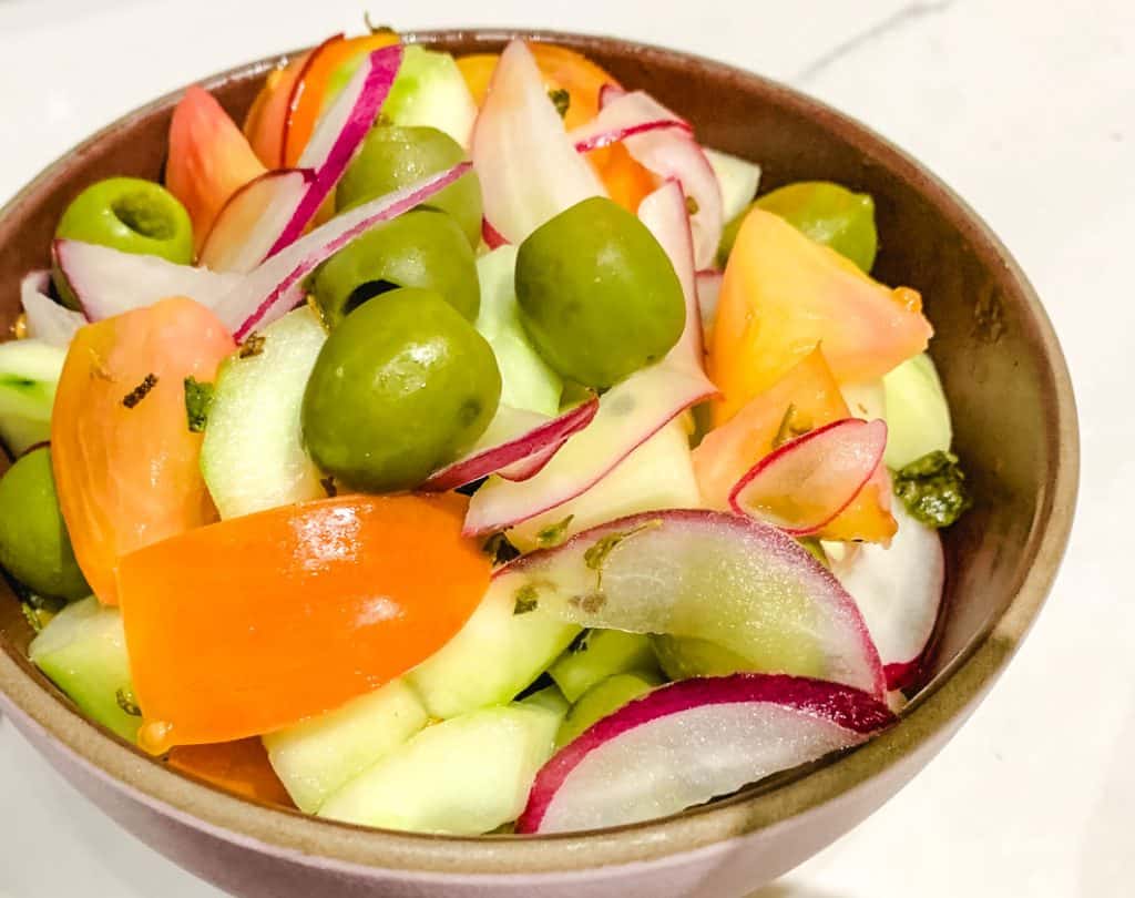 Greek salad with green olives in a bowl