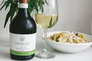 Corvezzo Prosecco with a bowl of Artichoke Alfredo