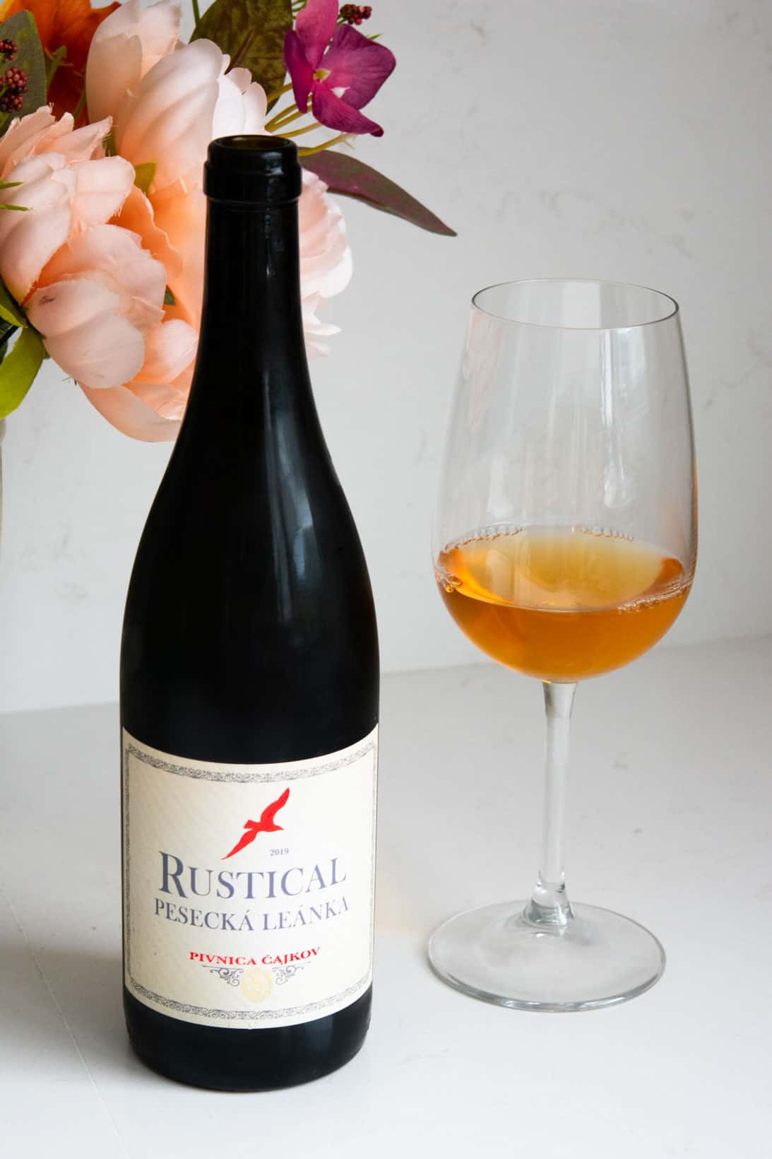 Bottle and glass of Princess Rustical orange wine