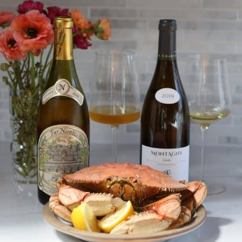 2 Chardonnay bottles with crab