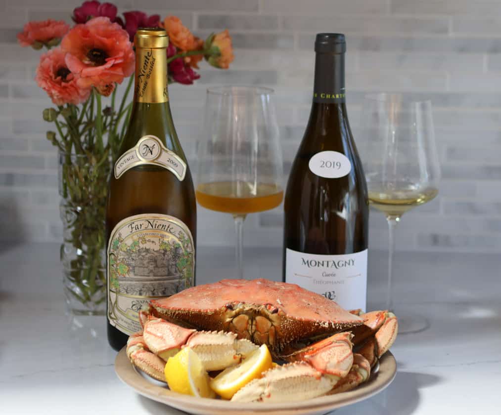 2 Chardonnay bottles with crab