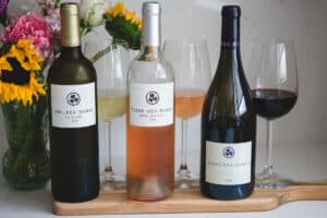 3 Terre des Dames wines on a white background